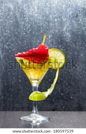 Cocktail with fresh lime and strawberry at the club