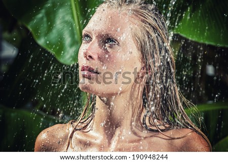 woman in tropical shower in the summertime