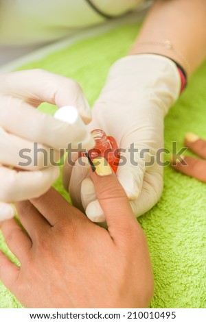 Woman getting her manicure done