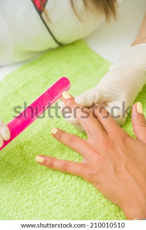 Woman getting her manicure done