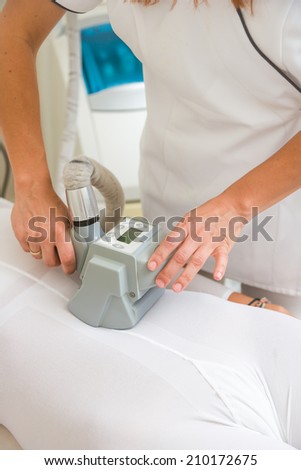 Therapist applying lipo massage LPG treatment