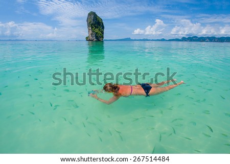 Woman swimming with snorkel, Andaman Sea, Thailand