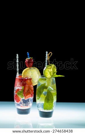 Mojito cocktail with fresh lime and strawberries at the club