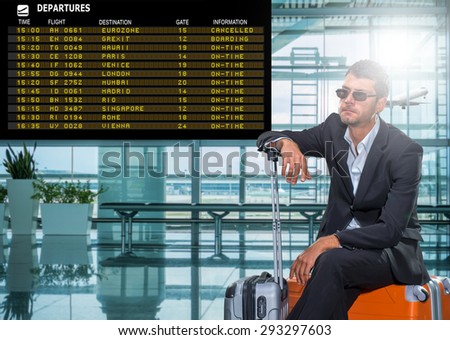 Business man at the airport - The board read Eurozone cancelled Gexit Boarding
