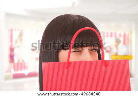 Close-up of young woman whith shopping bags  in the shopping mall