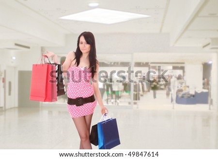 Close-up of young woman whith shopping bags  in the shopping mall