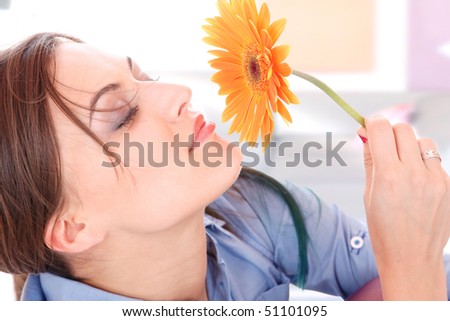 Close-up of beautiful woman face with sunflower.