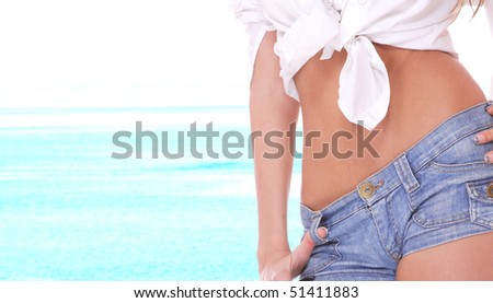 girl in jeans shorts over sea background