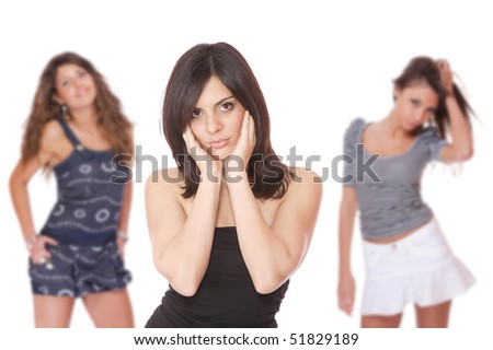 Group of happy pretty girls over white background focused on the front girl