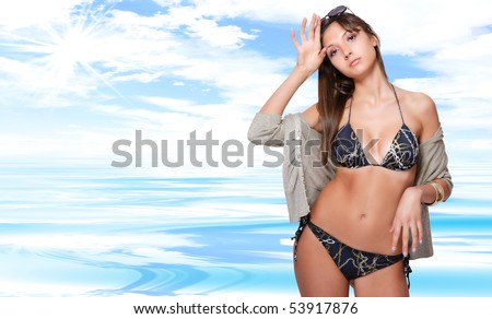 Sexy bikini model over sea background