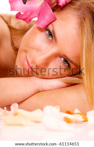 beautiful long-haired girl relaxing in spa salon