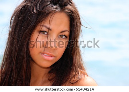 sexy asian girl posing by the sea in Greece
