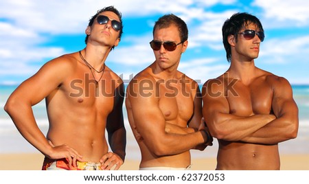Three Young Men Relaxing On the Beach