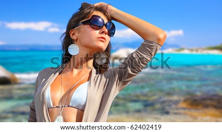 A beautiful young woman at the beach in Greece