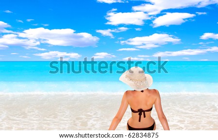 Beautiful young woman relaxing by the beach in Greece