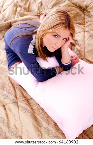 Closeup portrait of a cute young woman on the bed
