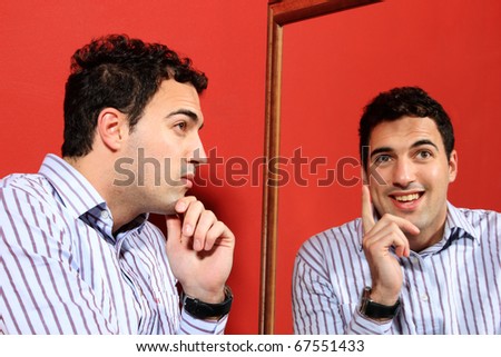 One man, with two faces on the mirror over red background