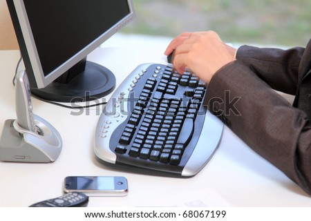Businessman with desktop PC at office