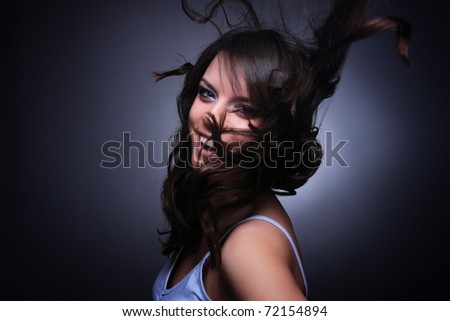 Portrait of glamour woman over dark gray background