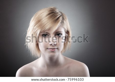 desaturated Portrait of glamour woman over dark gray background
