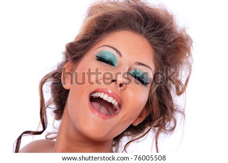 Portrait of a beautiful female model making faces on white background