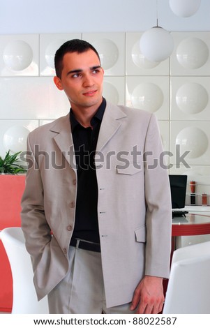 Smiling businessman  at the office reception
