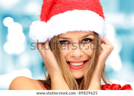 Beautiful Young Happy Christmas Woman over nice bokeh background