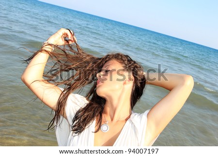 Photograph of a beautiful woman on the beach in Greece