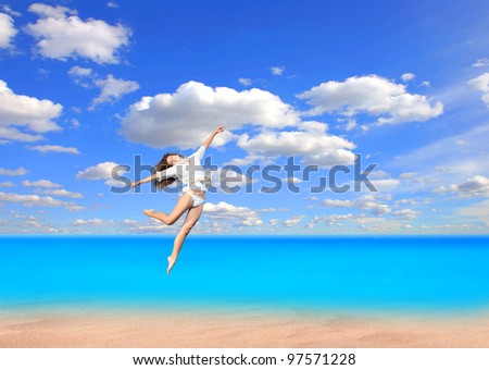Beautiful young sexy  model jumping on the beach
