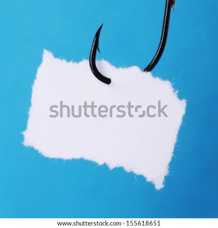 paper note at the fishing hook isolated on white background