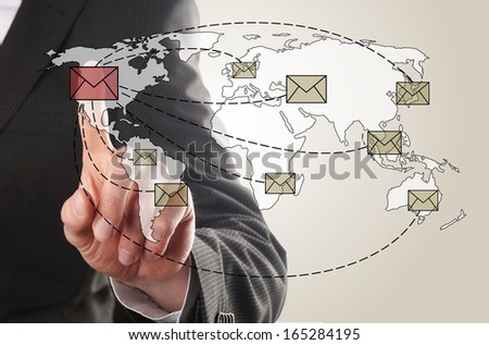 businessman send an email to his contacts around the world