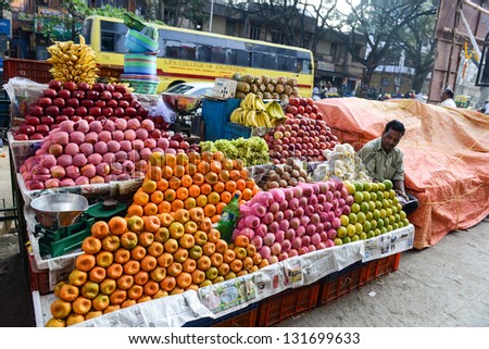 BANGALORE, IN - JANUARY 09: Vendor sells fruit on the street in Bangalore, IN January 09, 2013 in Bangalore, India. 42% of India falls below the international poverty line of $1.25 a day.