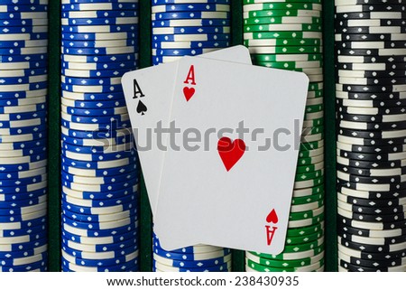 Pair of Aces on a Rows of Betting Poker Chips
