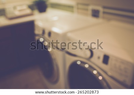 Blurred Laundry Room with Washer and Dryer with Retro Instagram Style Filter