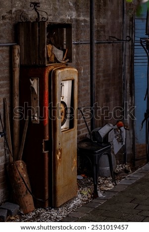 Image, Stock Photo Old dilapidated fuel pump for liquid fuel in detail with reflection of a blue oh so environmentally friendly xyz car