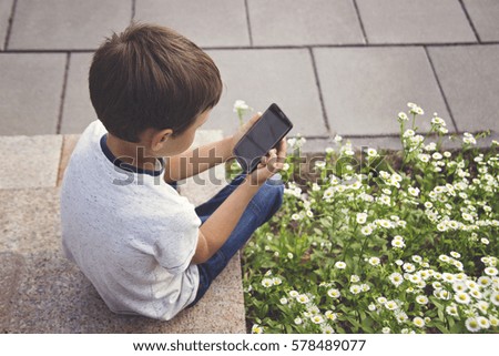 Similar – Image, Stock Photo boy with smartphone