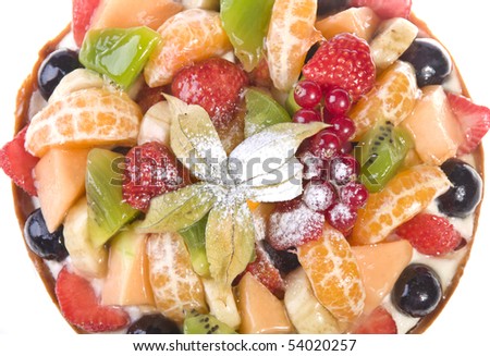 Cake with many fruits (oranges, strawberries, kiwi, grapes, red currants etc)