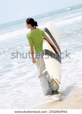 Similar – Image, Stock Photo Serene woman on surfboard in sea