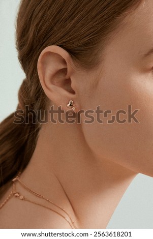 Similar – Image, Stock Photo Elegant earring in the glass with roses and rose petals