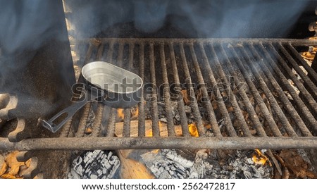 Similar – Image, Stock Photo Kettle placed on campfires in snowy woods at sundown