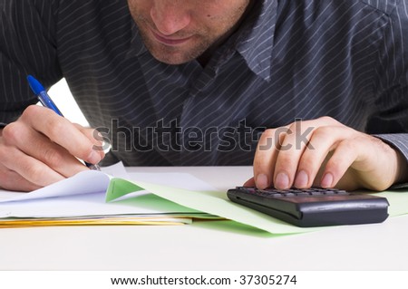 Man and  lots of paper work, looking stressed