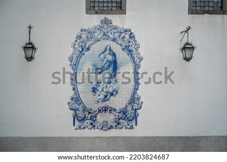 Virgin Mary in blue and white portuguese azulejo tiles at wall of the former Church and Monastery of Carmo - Text says: ”Virgin Mary our lady was conceived without original sin” - Guimaraes, Portugal Stok fotoğraf © 