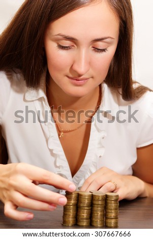Young woman thinks coins