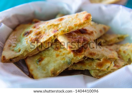 Similar – Foto Bild Portionen von leckerem Naan-Brot mit Lachs auf Tellern