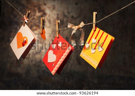 hand made valentine's cards hanging on a string