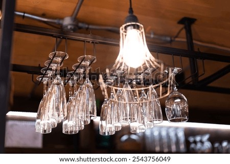 Similar – Image, Stock Photo Clean glasses hanging in bar