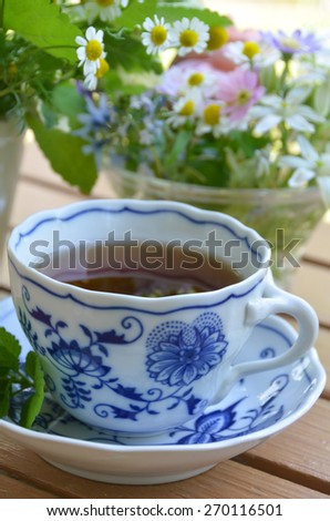 tea break with herbal flowers and leaves