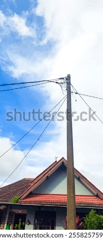 Similar – Image, Stock Photo Power poles in front of evening sky, taken through a power pole in the foreground, cropped, orange-black