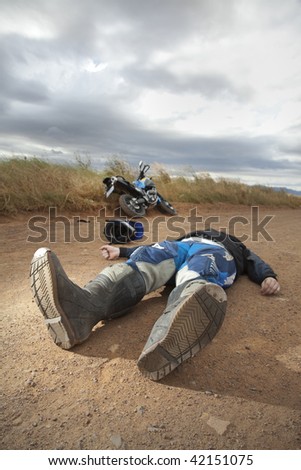 Man on ground after a motorcycle accident