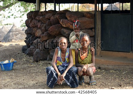 SENEGAL - FEBRUARY 15: Girls posing Bedik ethnicity, one of the characteristics of this ethnic group is the ear piercing and hair ornaments, February 15, 2007 in Country Bassari, Senegal